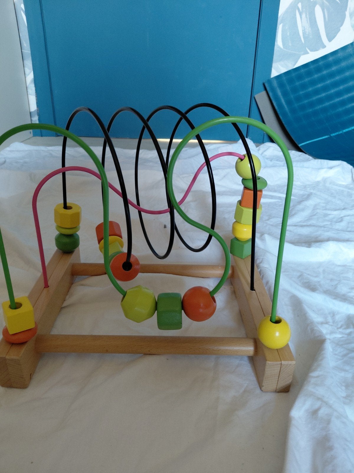 Houten kralen speelgoed, Ophalen