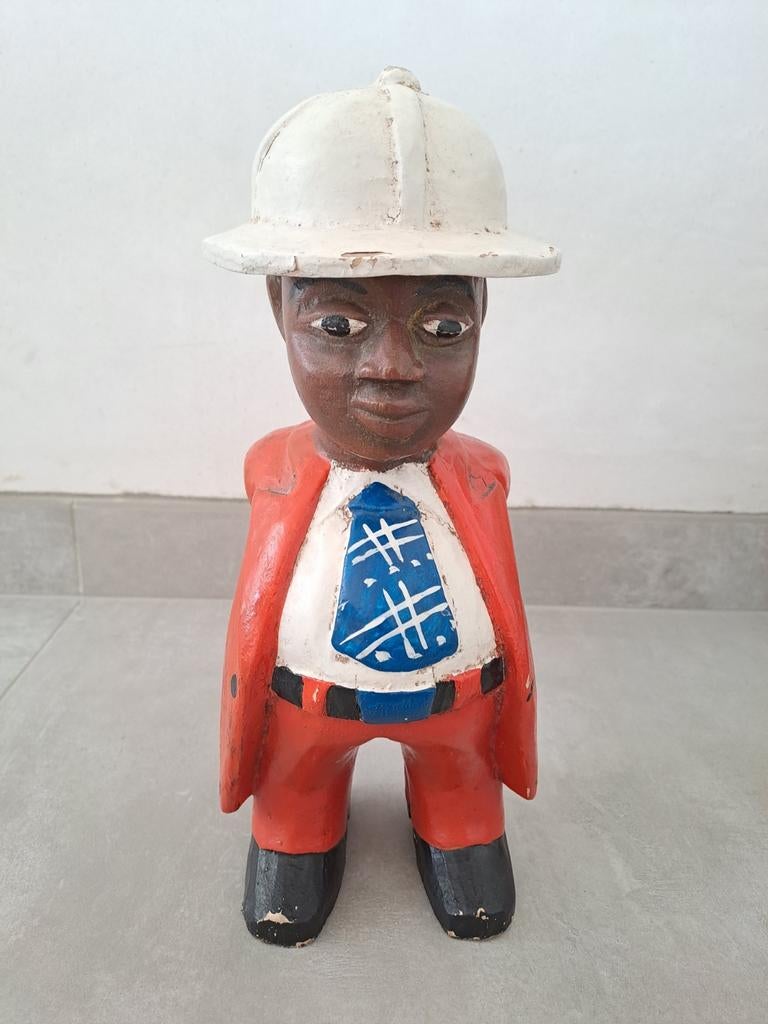 Image d'un homme d'affaires africain sculpté à la main en sa, Enlèvement