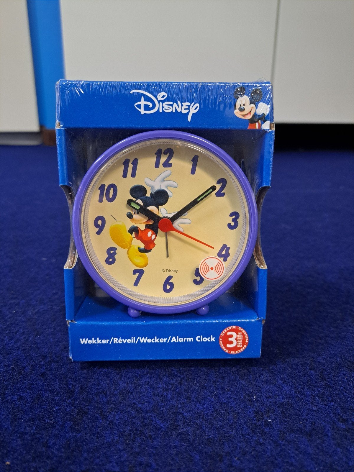 Paarse wekker Mickey Mouse., Ophalen