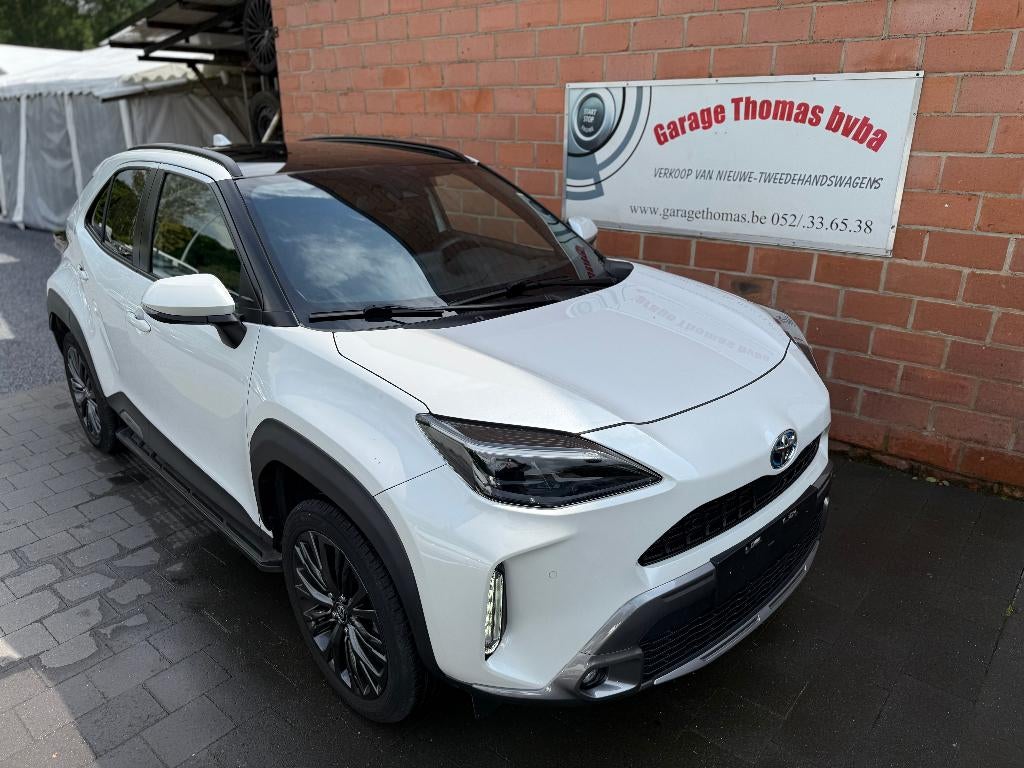 toyota Yaris  cross 1.5 hybride adventures 4x4, Auto's, Automaat, Stof, Euro 6, Wit