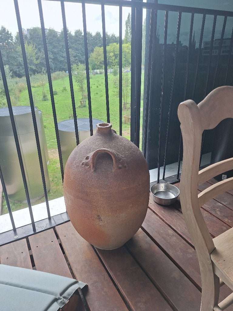 Grote teracotta kruik, Ophalen