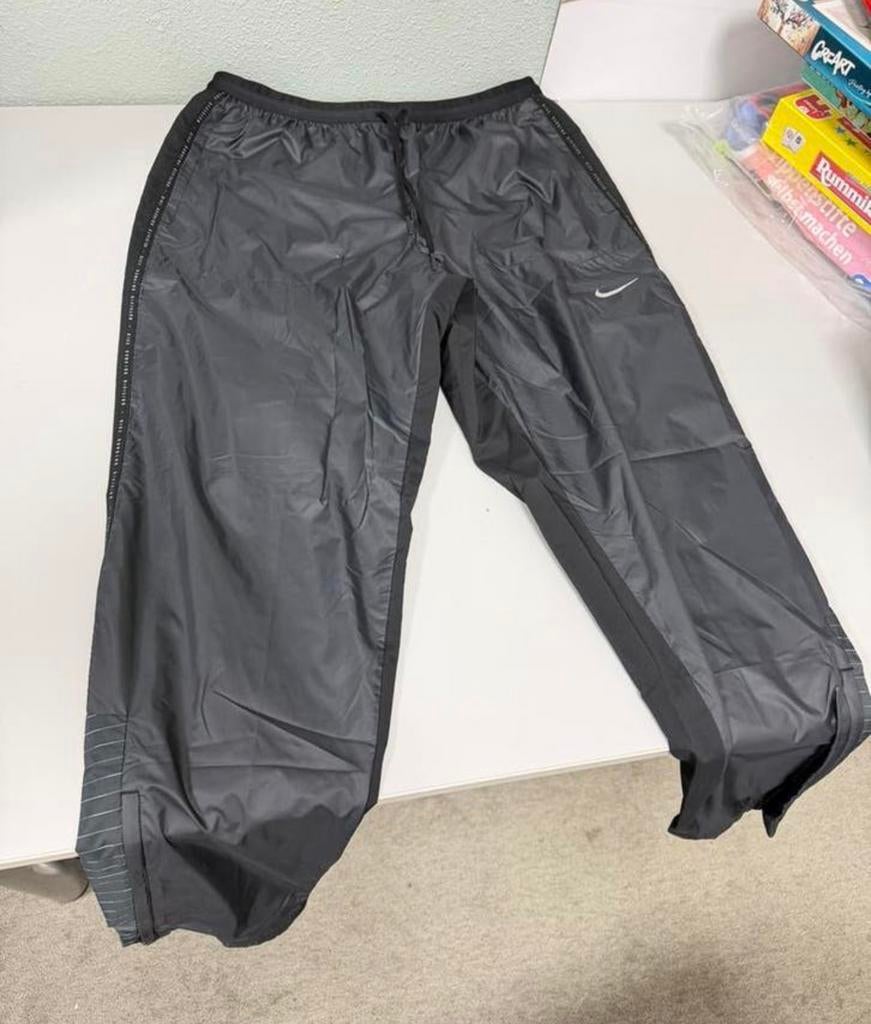 Pantalon Nike Storm-fit Running Division L imperméable Zgan, Caravanes & Camping, Vêtements de pluie, Enlèvement ou Envoi, Comme neuf