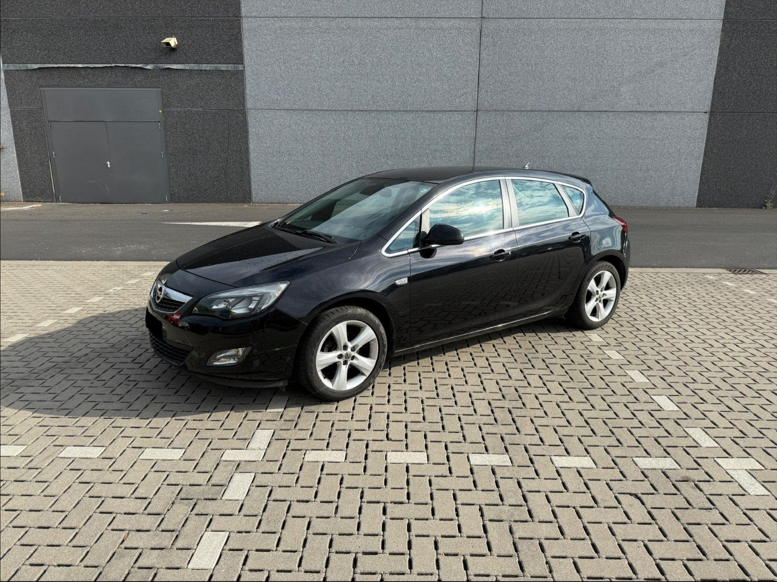 Zwarte Opel Astra 1.4 Sport (bj 2010), Auto's, Opel, Voorwielaandrijving, Euro 5, Stof, Zwart