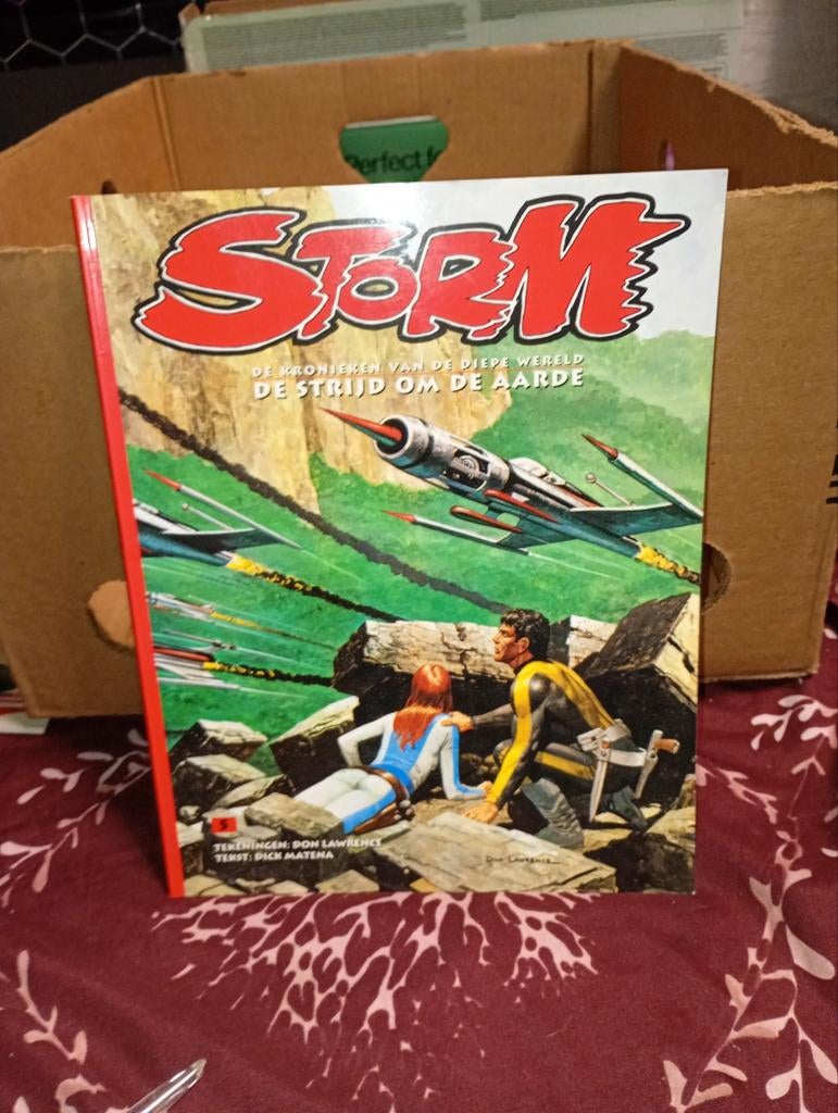 Couverture souple en couleur non lue de la série, STORM,, Une BD, Enlèvement ou Envoi, Comme neuf, Don Lawrence
