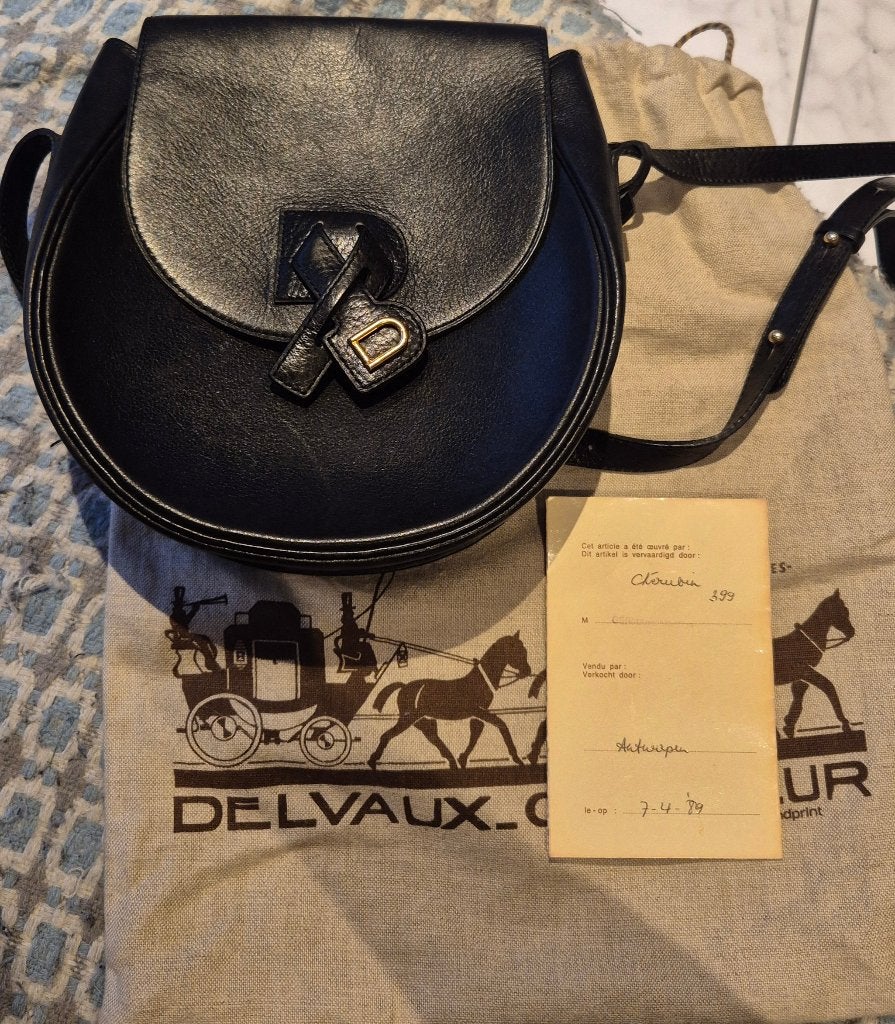 Delvaux schoudertas, Ophalen