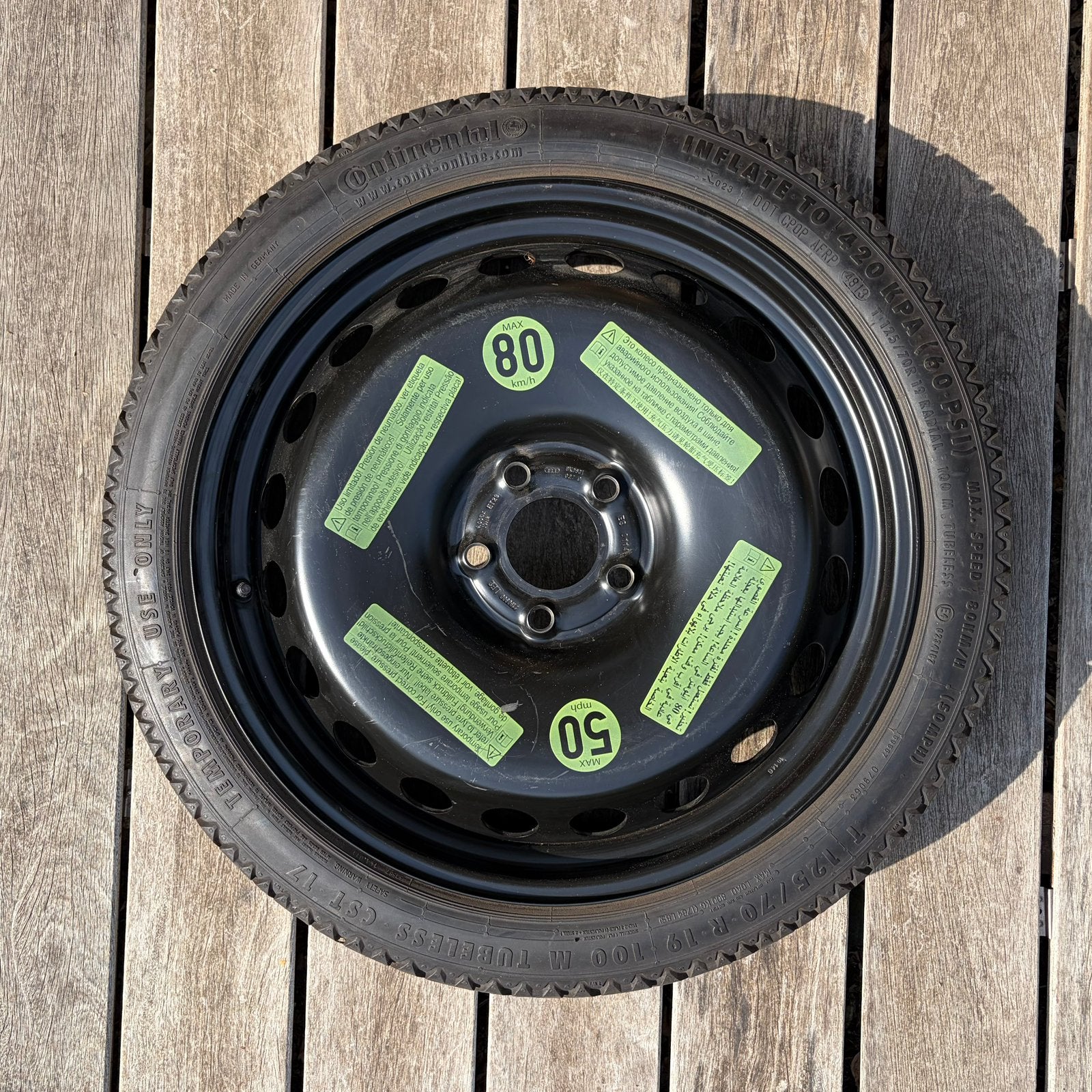 Roue de secours galette. T125/70R19, Enlèvement