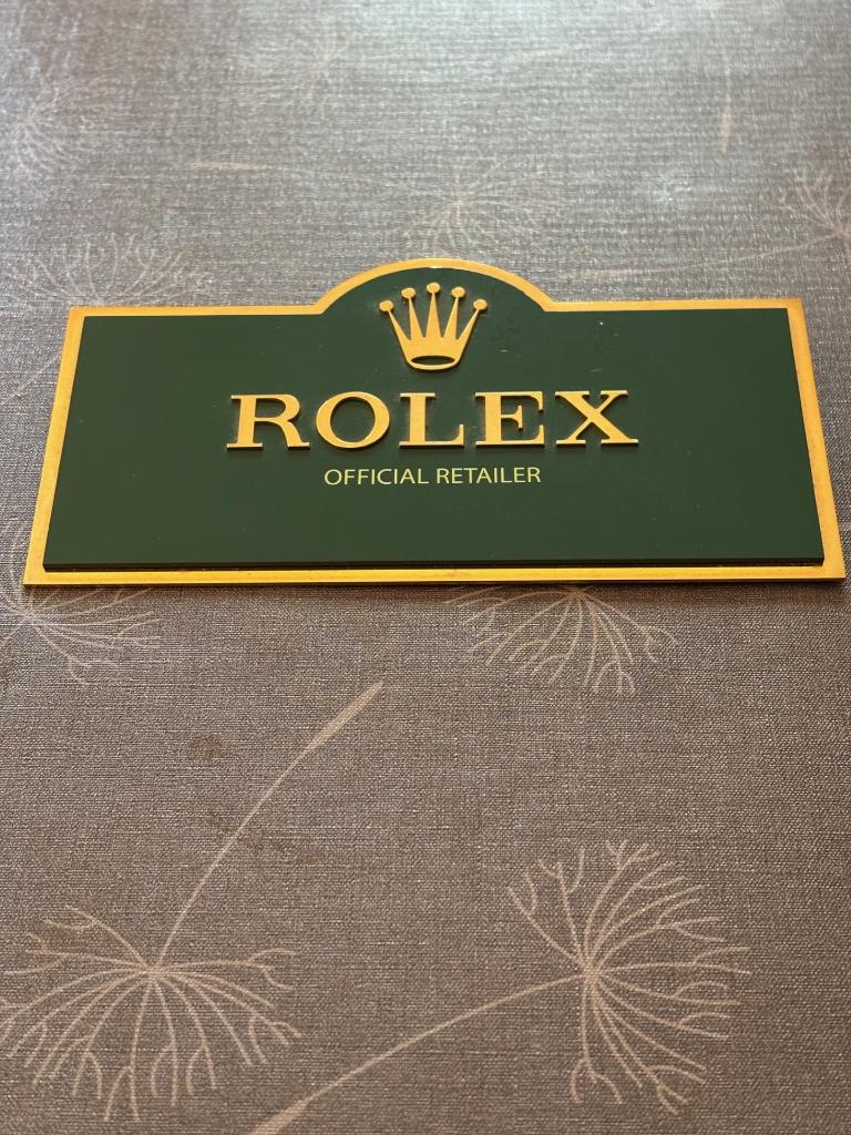 Grande plaque (18 X8.5 cm) Rolex "Official Retailer", Enlèvement, Comme neuf, Ustensile