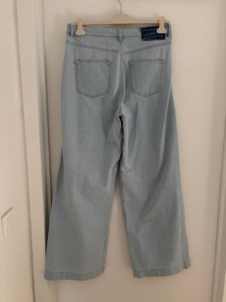 lichtblauwe, wijde jeans maat 30 (Large), Kleding | Dames, Spijkerbroeken en Jeans, E5-mode, Blauw, Nieuw, Ophalen of Verzenden