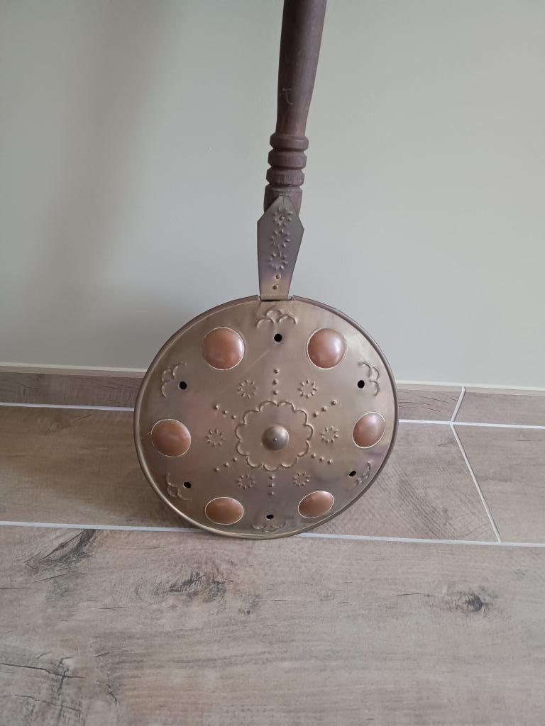 Antiek bedverwarmer, Ophalen
