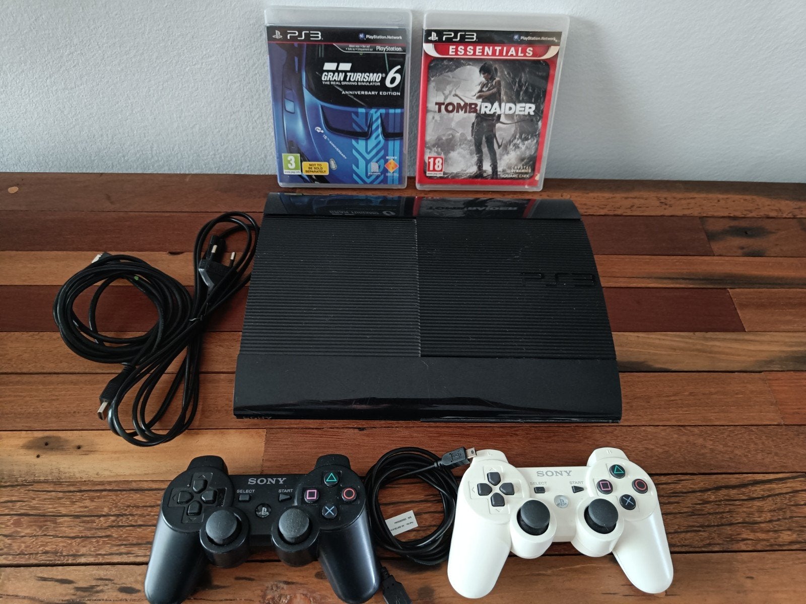 PlayStation 3 PS3 superslim 500 GB + 2 jeux et 2 manettes, Enlèvement