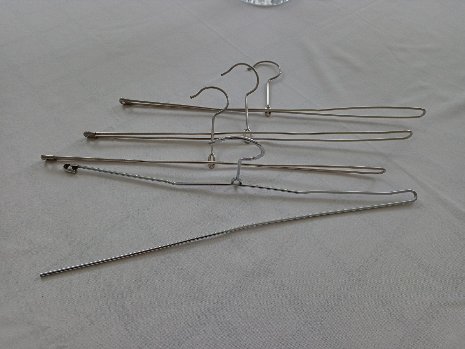 4 broekhangers (Inox), Ophalen