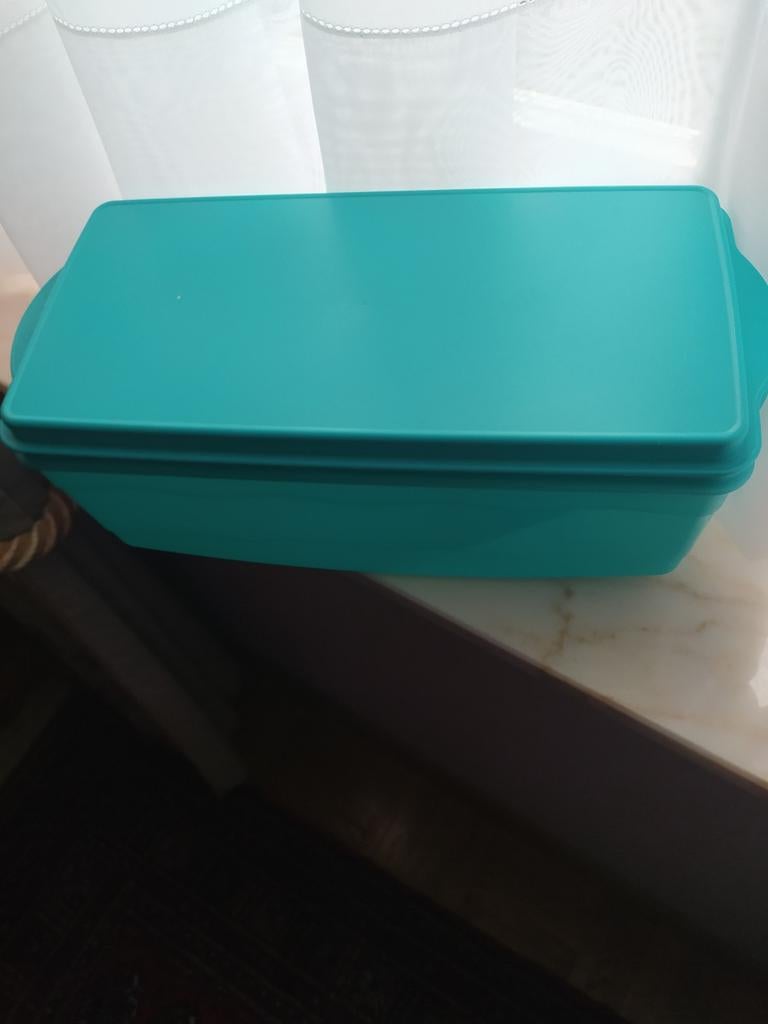 Grote doos van tupperware, Ophalen
