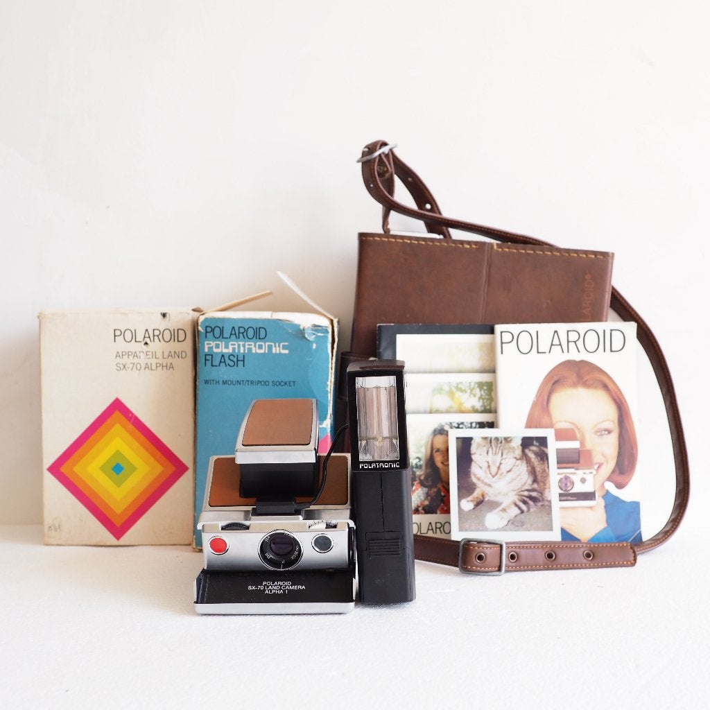 polaroid sx-70 werkend, met accessoires, Ophalen of Verzenden, Zo goed als nieuw, Polaroid, Polaroid