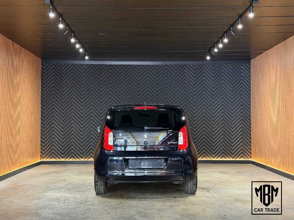 ✅ Skoda Citigo 1.0i 12 Maanden GARANTIE Airco, Auto's, Voorwielaandrijving, Stof, Electronic Stability Program (ESP), Zwart