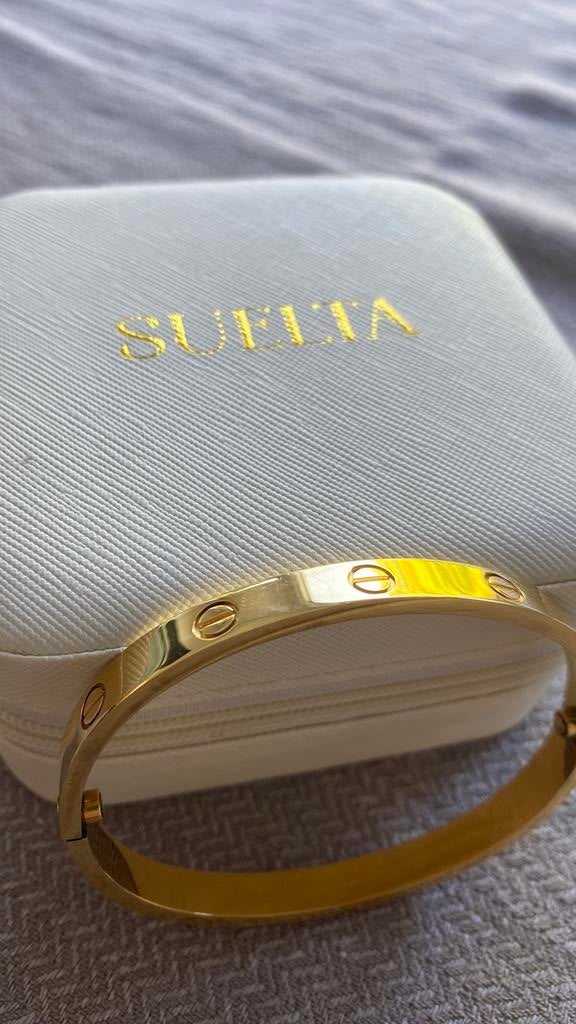 Suelta armband goudkleurig, Handtassen en Accessoires, Ophalen of Verzenden, Zo goed als nieuw
