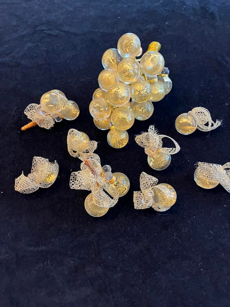 Druiventros en kleintjes Murano, Ophalen