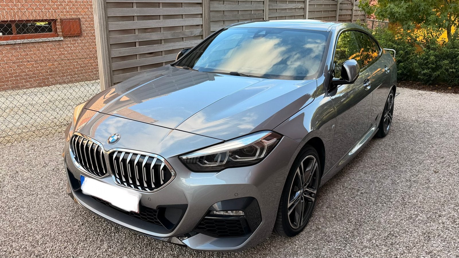 BMW 218i Gran Coupé M sportpakket, Auto's, Zwart, 1350 kg, Leder en Stof, 3 cilinders