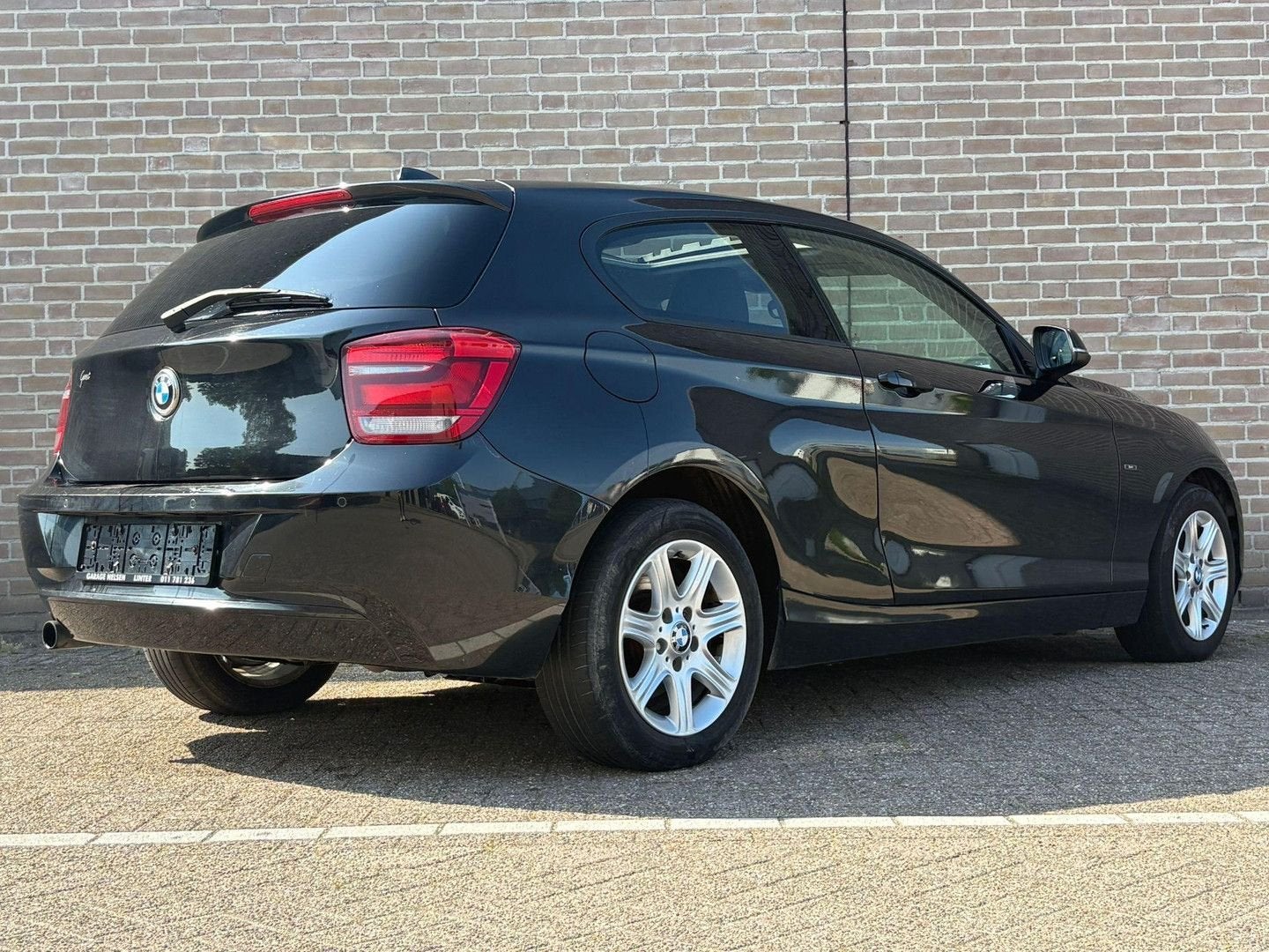 BMW 114 1-serie 114i | Pano | Airco | Cruise | Keyless |, Auto's, BMW, 1 Reeks, 129 g/km, Start-stop-systeem, Zwart