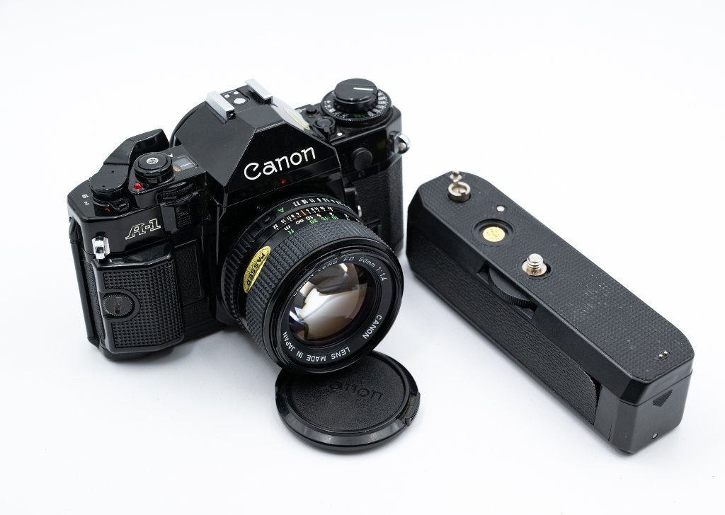 Canon A-1 + Canon FD 50mm f/1.4 + Grip Motor Drive, Enlèvement ou Envoi, Utilisé, Reflex miroir, Canon