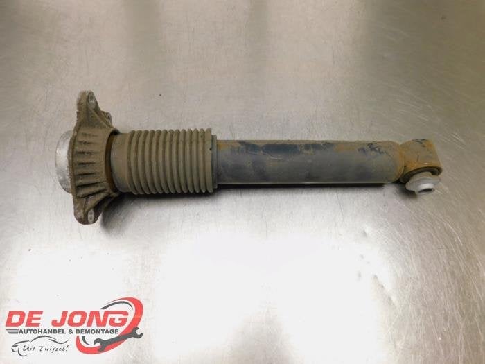 Amortisseur arrière gauche d'un BMW 5-Serie, -, 3 mois de garantie, Utilisé, -