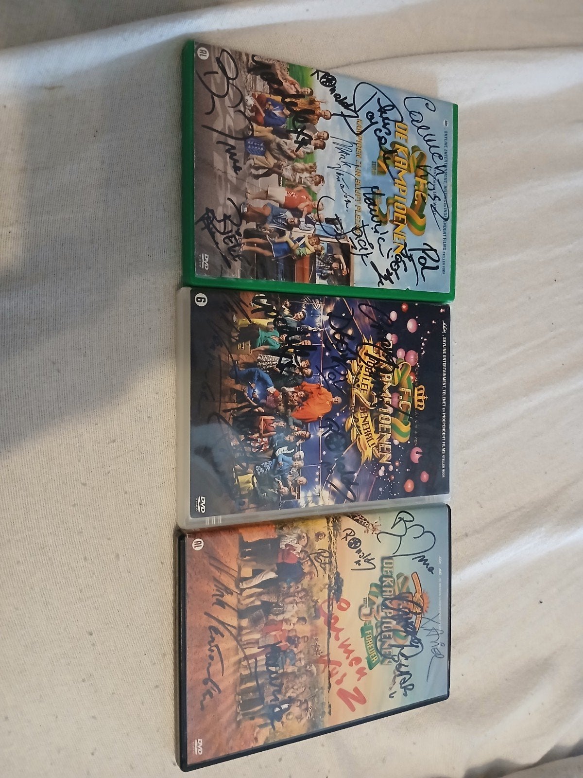 Lot gesigneerde FC De Kampioenen dvds, Ophalen of Verzenden