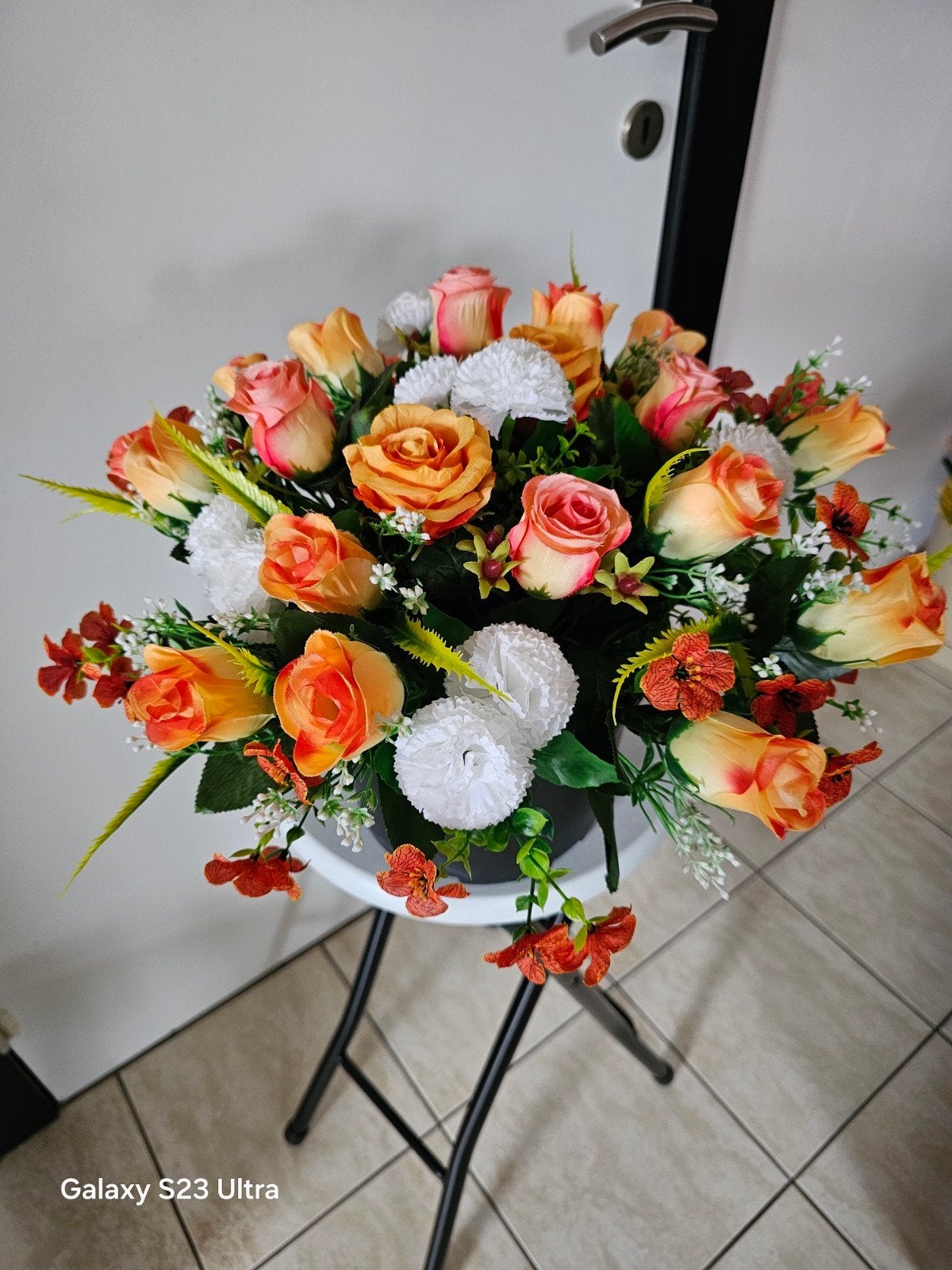 Montage fleurs artificielles pour Toussaint, Ophalen