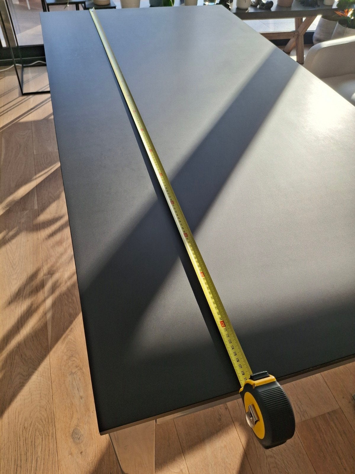 Zwarte granieten eetkamertafel voor 10 tot 12 personen., Ophalen, Overige materialen, Gebruikt, 200 cm of meer