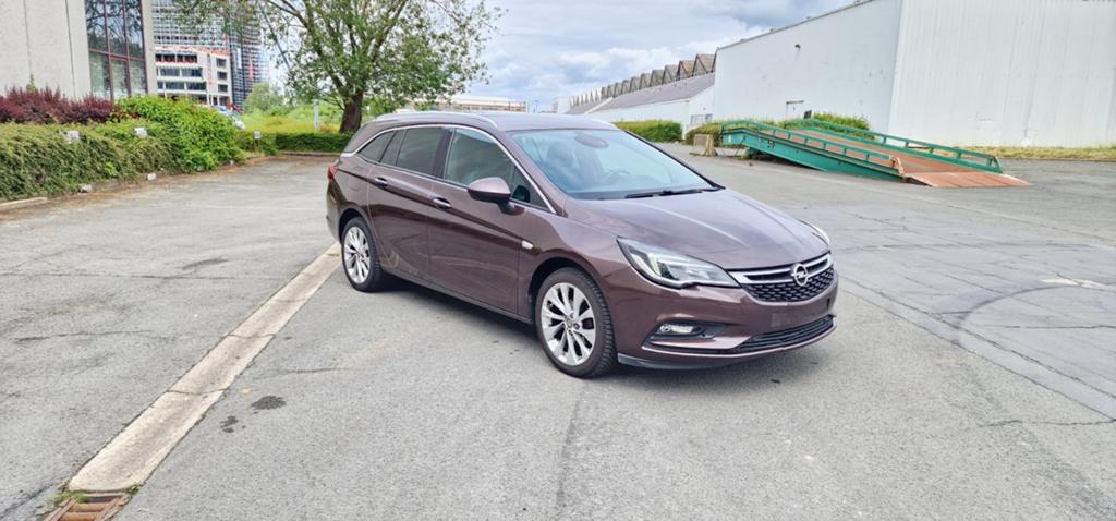 Opel Astra 1.4 Turbo Benzine Euro 6 2017 met 115.000km, Auto's, Voorwielaandrijving, 4 cilinders, Bruin, Leder en Stof