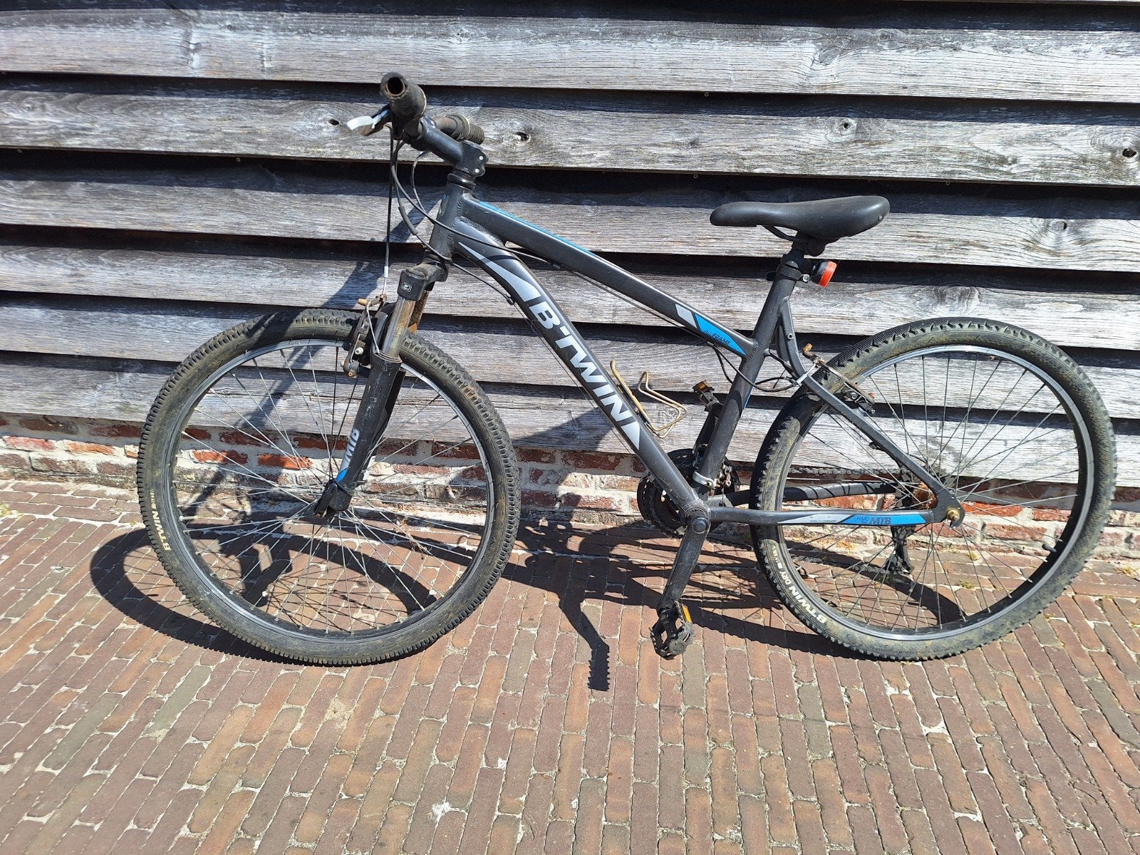 Een 3 tal (cross)mountainbikes, Ophalen