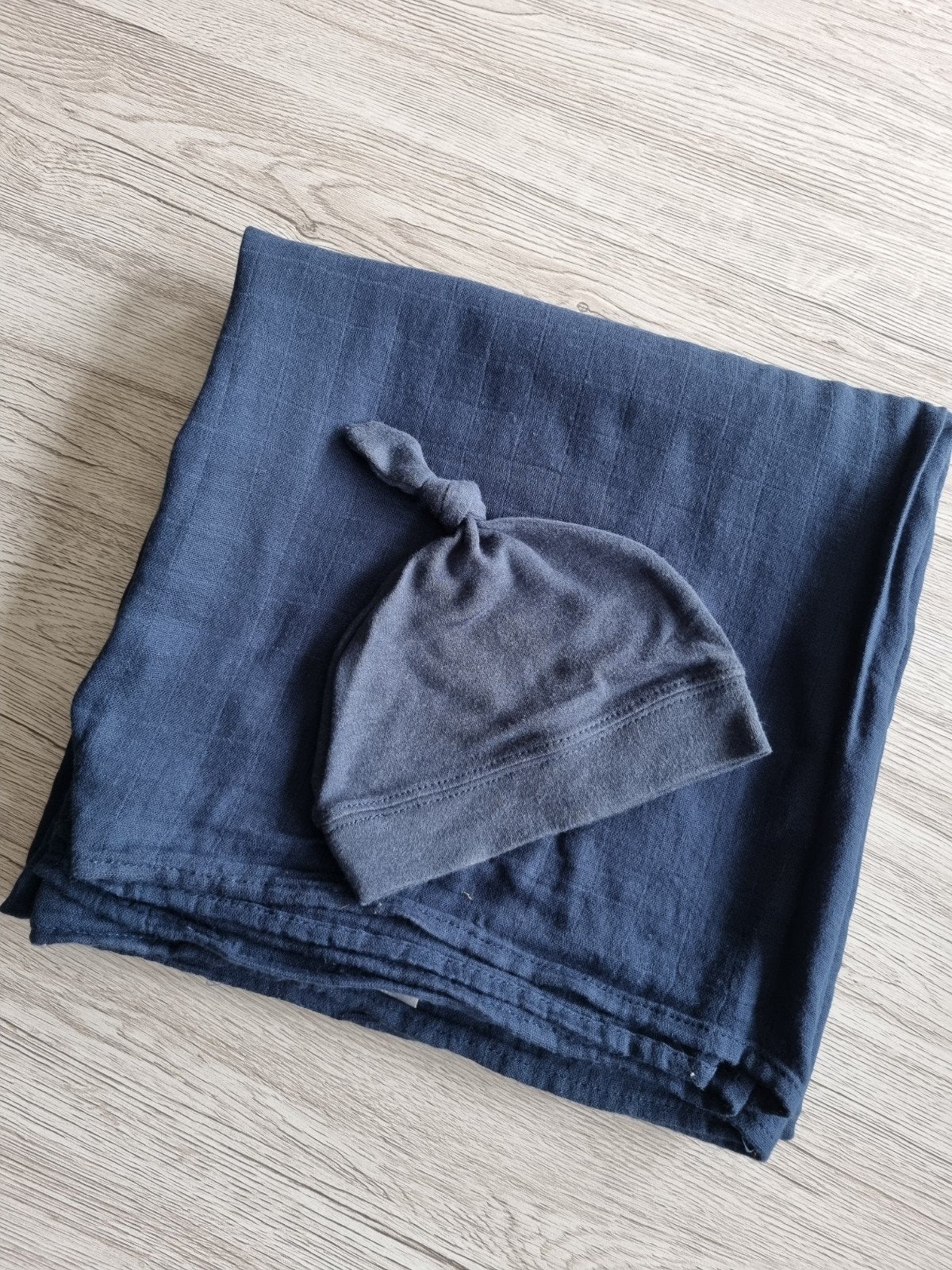 inbakerdoek met muts, Ophalen