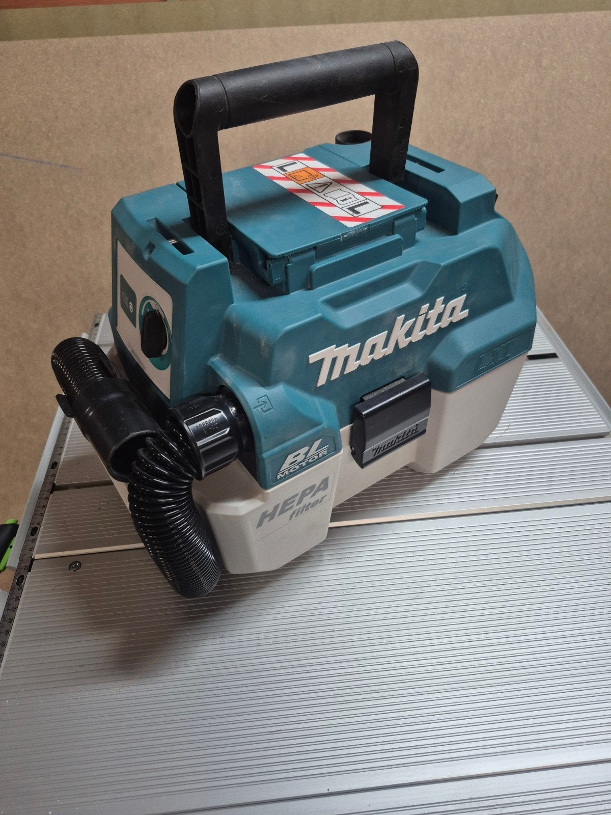 Makita accu stofzuiger, Ophalen