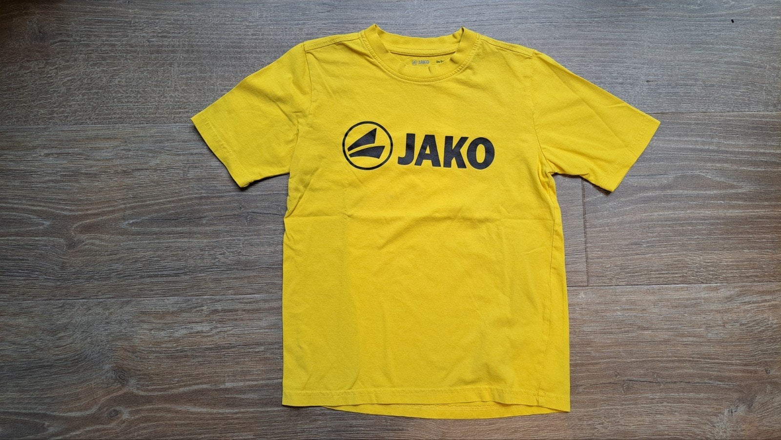 Geel shirt Jako, maat 140 of 10 jaar., Kinderen en Baby's, Kinderkleding | Maat 140, Gebruikt, Jako, Jongen of Meisje, Ophalen of Verzenden