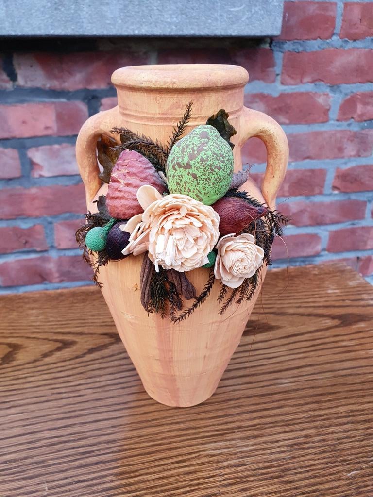 Kruik met droogbloemen, Ophalen