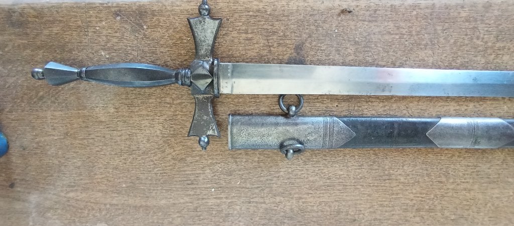 Épée vers 1900, Enlèvement