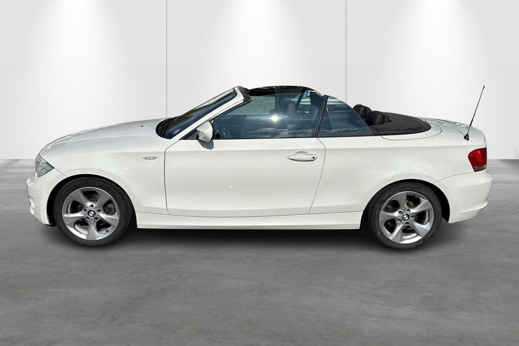 BMW 1-serie Cabrio 118i (105 kW) 1ste eigenaar met onderhoud, Auto's, BMW, Gebruikt, Zwart, 4 cilinders, Cabriolet