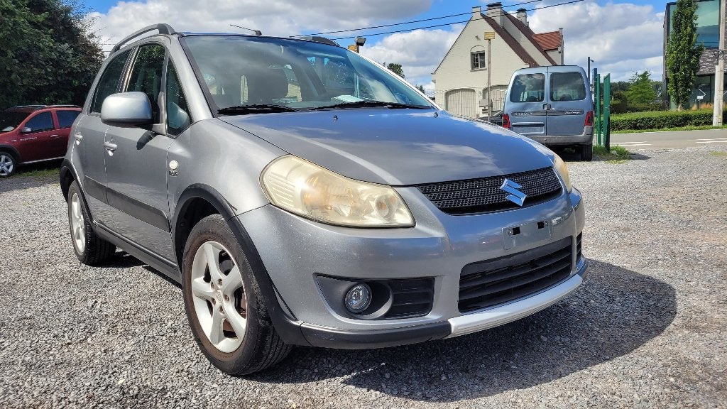 suzuki SX4 1.9TD 117000KM OHBOEK AIRCO 2010, Auto's, Suzuki, Voorwielaandrijving, Stof, Sound system, 4 cilinders