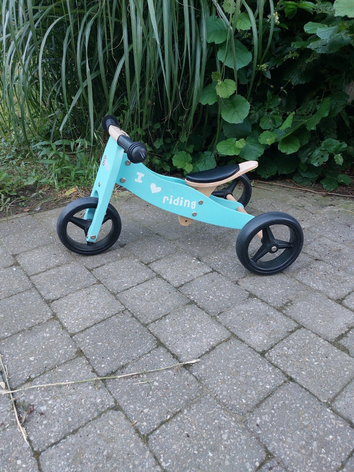 Houten verstelbaar loopfietsje, Ophalen