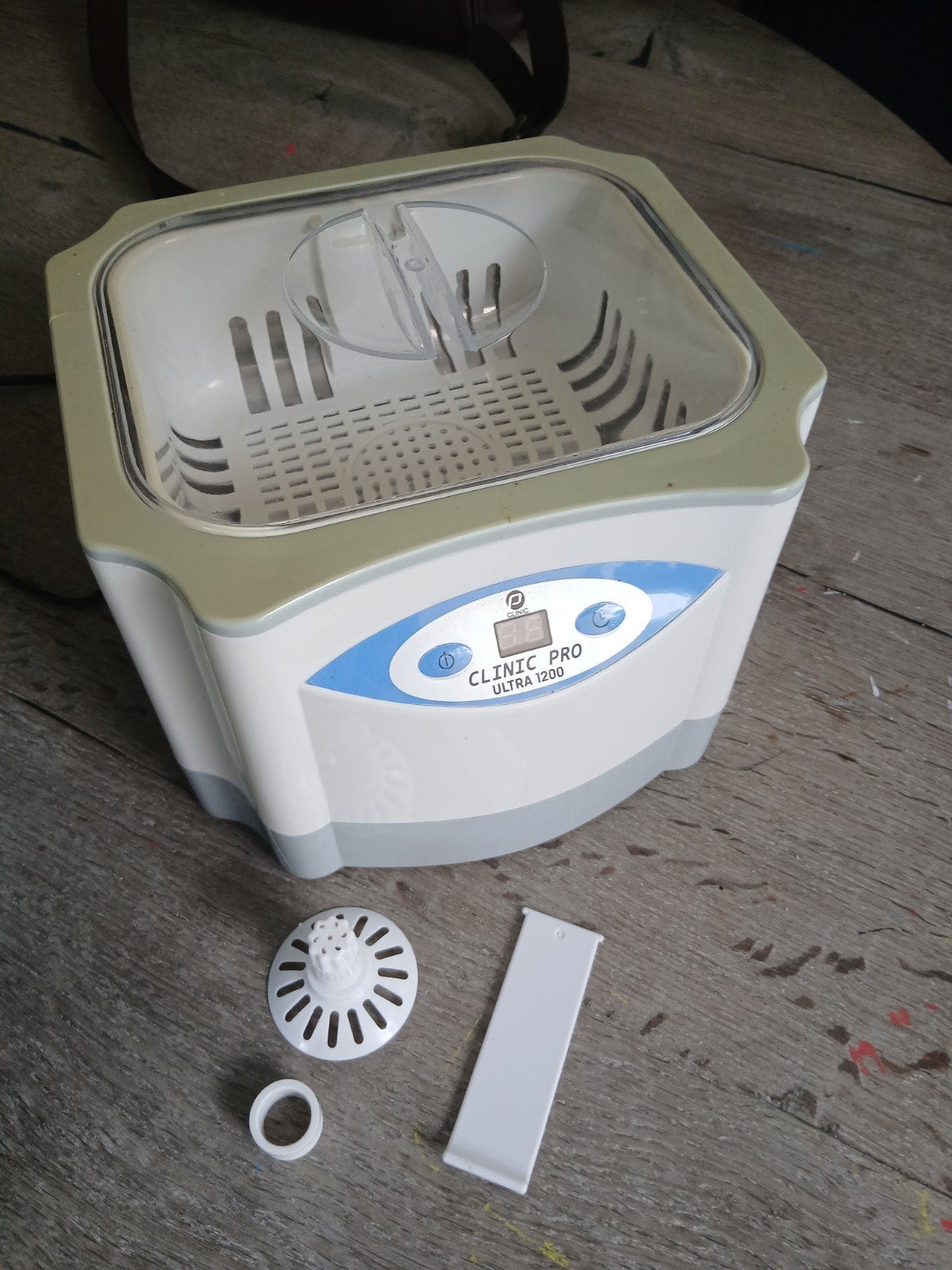 Ultrasone reiniger + product, Ophalen