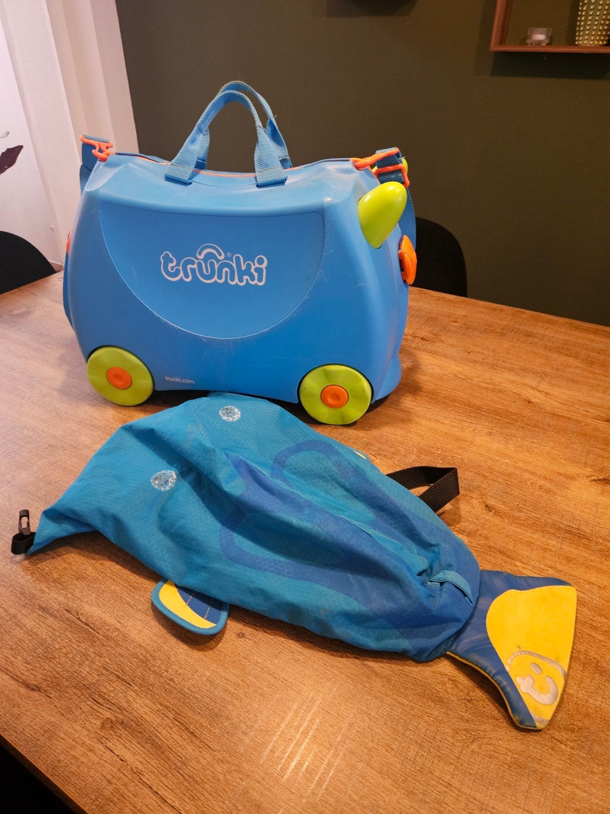 koffer en zwemzak Trunki, Ophalen