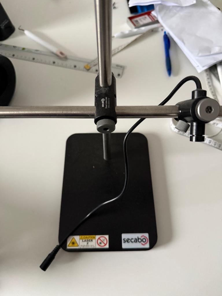 Laser de positionnement textile Secabo, Enlèvement