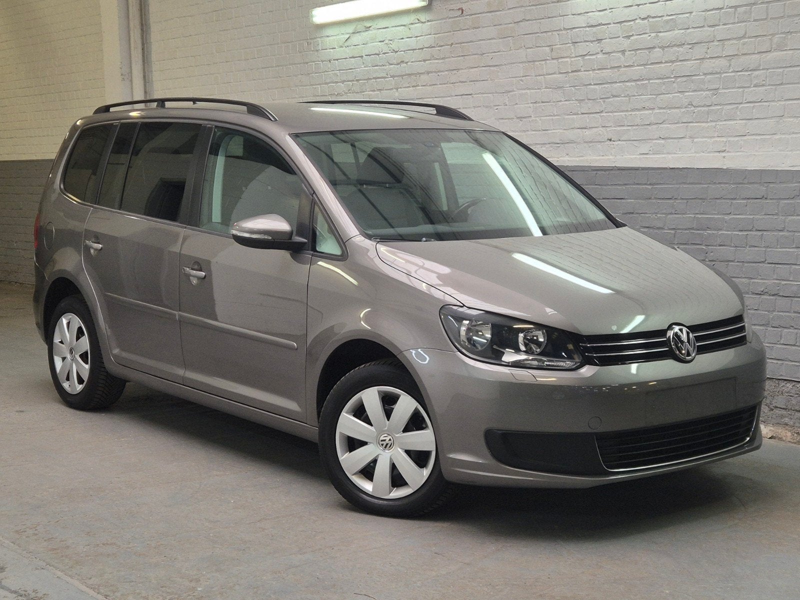 Vw Touran 1.2TSi -Euro5- 7 pl.-1eig.-Topstaat - Garantie, Auto's, Zwart, 4 cilinders, Parkeersensor, Handgeschakeld