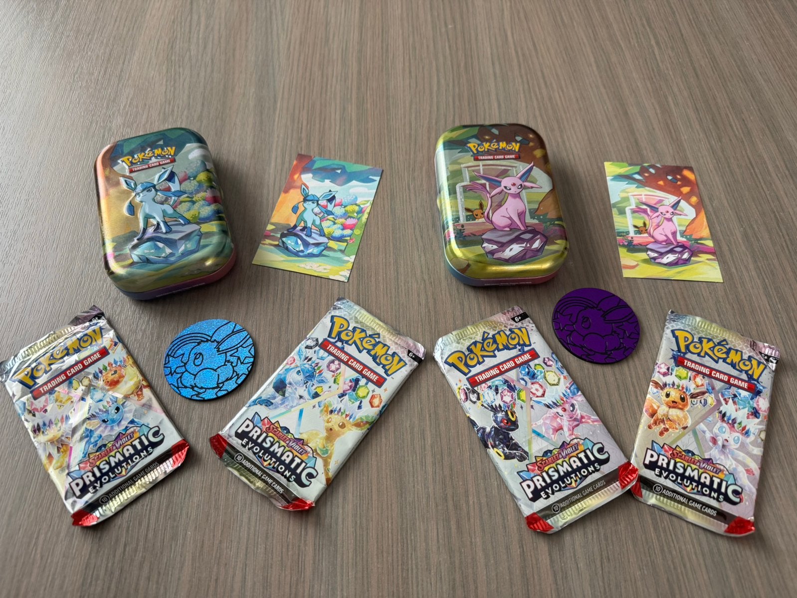 Prismatic Evolutions Espeon en Glaceon Pokemon tin geopend, Ophalen of Verzenden, Gebruikt, Booster