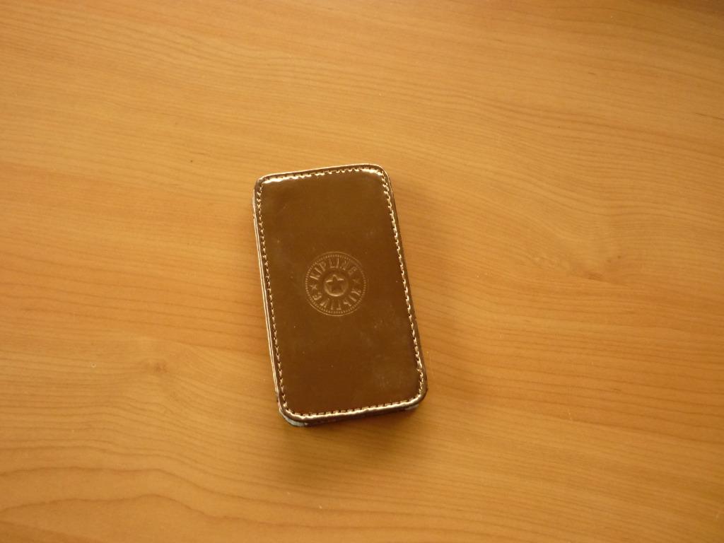 Gratis Bruin metallic GSM-houder van Kipling, Telecommunicatie, Ophalen of Verzenden