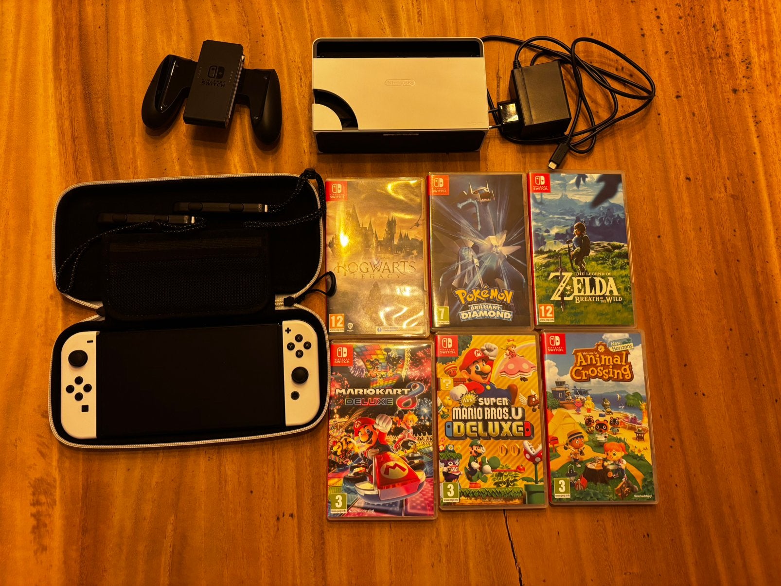 Nintendo Switch OLED + bijhorende accessoires + 6 games, Ophalen, Zo goed als nieuw, Switch OLED