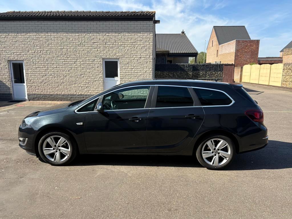 Opel Astra Sports Tourer 1.4 Benzine (2015), Auto's, Euro 5, 139 g/km, 1384 cc, Zwart