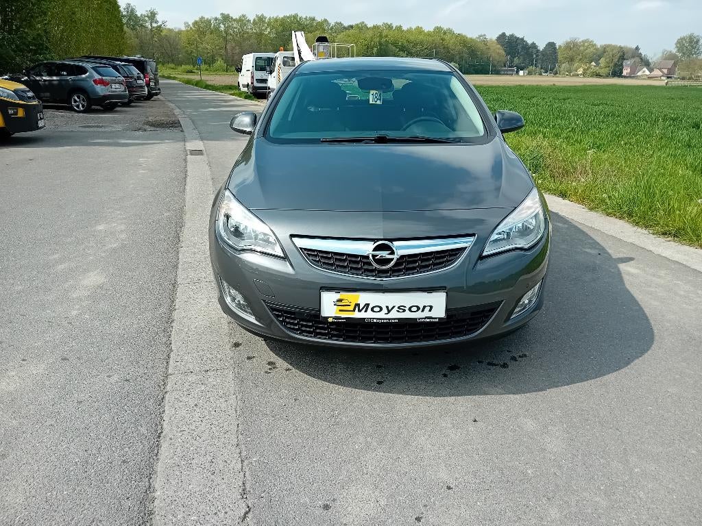 Opel Astra benzine met slechts 63000kms!! - 1 jr garantie, Auto's, Voorwielaandrijving, Euro 5, Stof, 4 cilinders