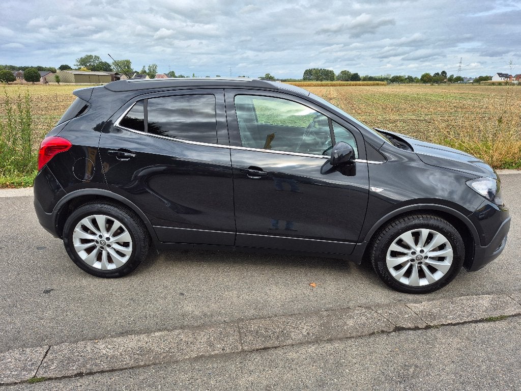 Opel Mokka 1.4 T Cosmo * 1 jr garantie, Auto's, Opel, Voorwielaandrijving, Dealer onderhouden, 4 cilinders, Zwart