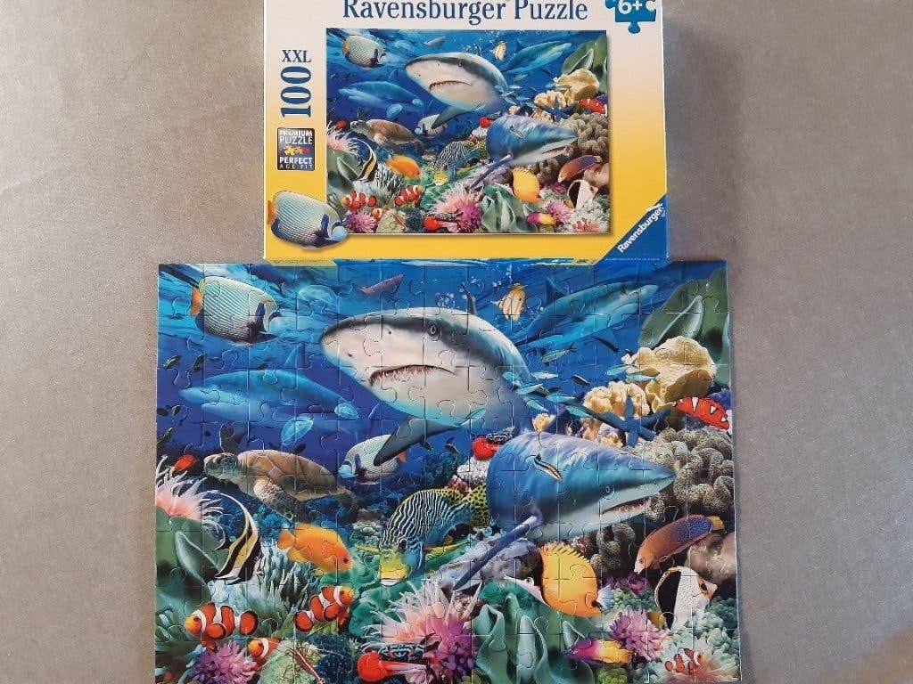 Puzzel ravensburger 100 xl Haaienrif, Enlèvement ou Envoi, Plus de 50 pièces, Comme neuf, 6 ans ou plus