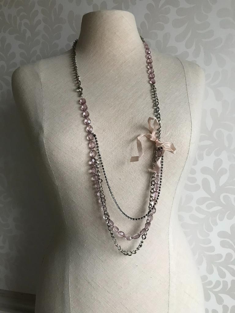Ketting met roze strik, Ophalen of Verzenden, Gebruikt, Roze, Overige materialen