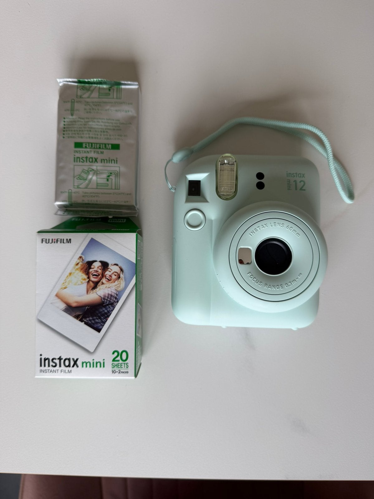 Instax mini 12 nieuwstaat met ongebruikt fotopapier, Ophalen of Verzenden, Zo goed als nieuw